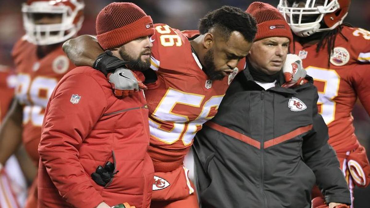 Kansas City Chiefs inside linebacker Derrick Johnson (center) was helped off the field after being injured in the Chiefs-Raiders game at Arrowhead Stadium on December 8, 2016.