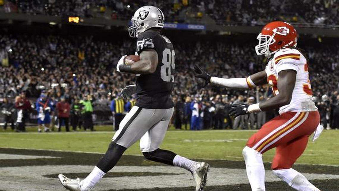 
Oakland’s James Jones caught a touchdown pass in front of the Chiefs’ Ron Parker for the winning score on Thursday.
