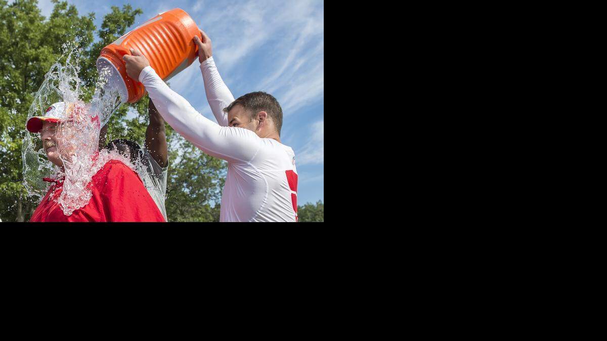 
Kansas City Chiefs head coach Andy Reid was dunked with a bucket of ice water by quarterback Chase Daniel and running back Jamaal Charles after the final training camp practice on Thursday morning during Kansas City Chiefs summer training camp practice at Missouri Western State University in St. Joseph, Mo.
