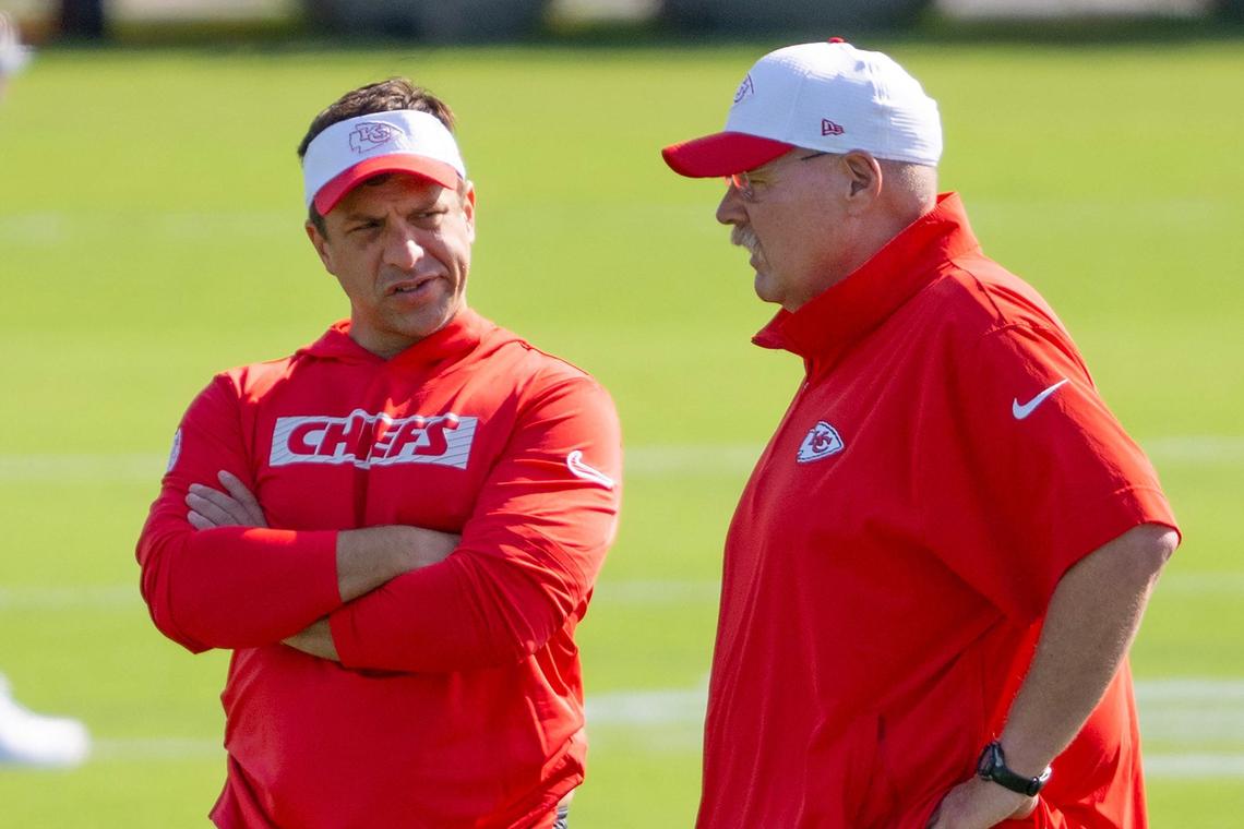 Kansas City Chiefs general manager Brett Veach, left, and head coach Andy Reid speak while observing players during practice at Chiefs training camp on Wednesday, July 17, 2024, in St. Joseph.