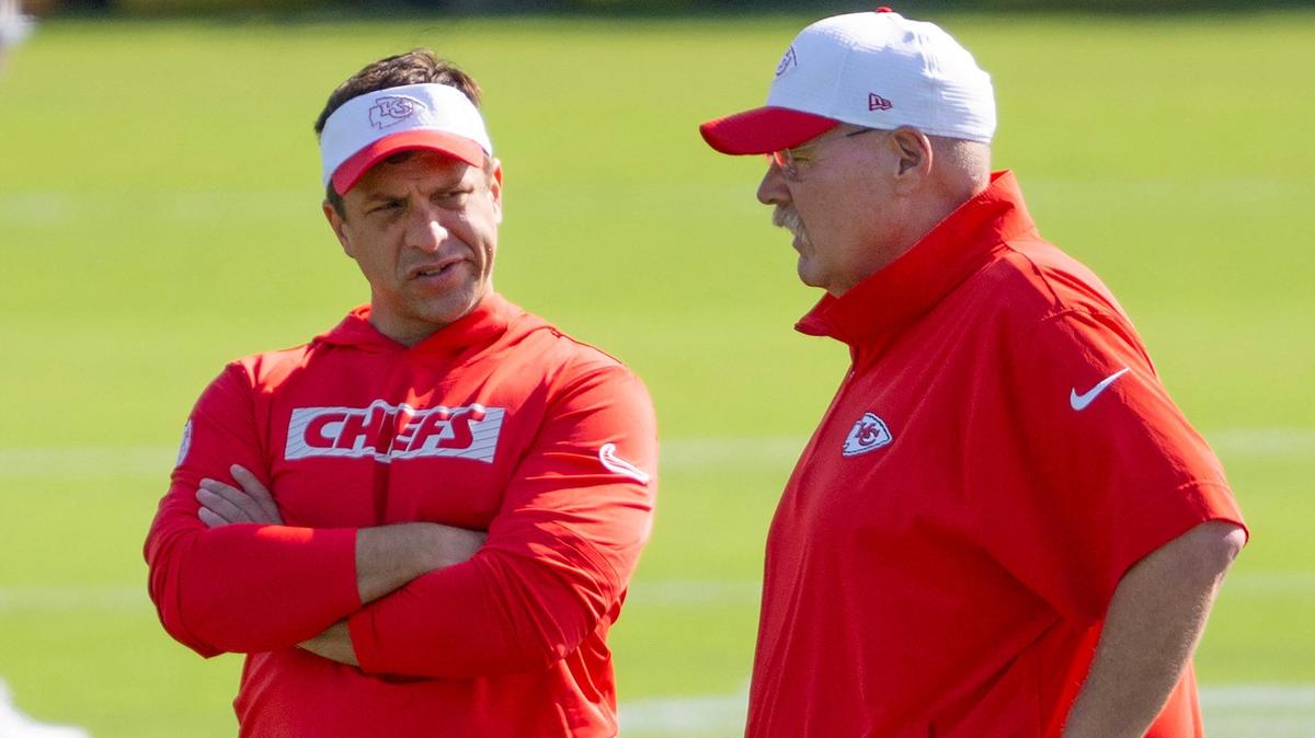 Kansas City Chiefs general manager Brett Veach, left, and head coach Andy Reid speak while observing players during practice at Chiefs training camp on Wednesday, July 17, 2024, in St. Joseph.