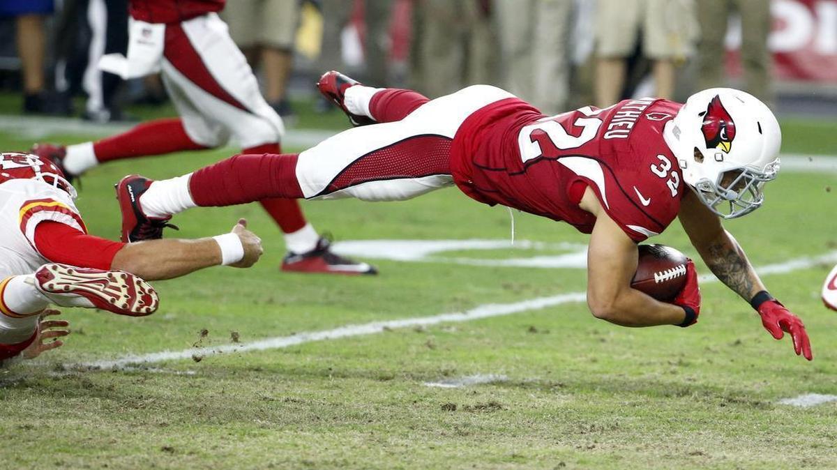
Arizona Cardinals free safety Tyrann Mathieu was tripped up by Chiefs quarterback Alex Smith after intercepting a pass during the first half Saturday.
