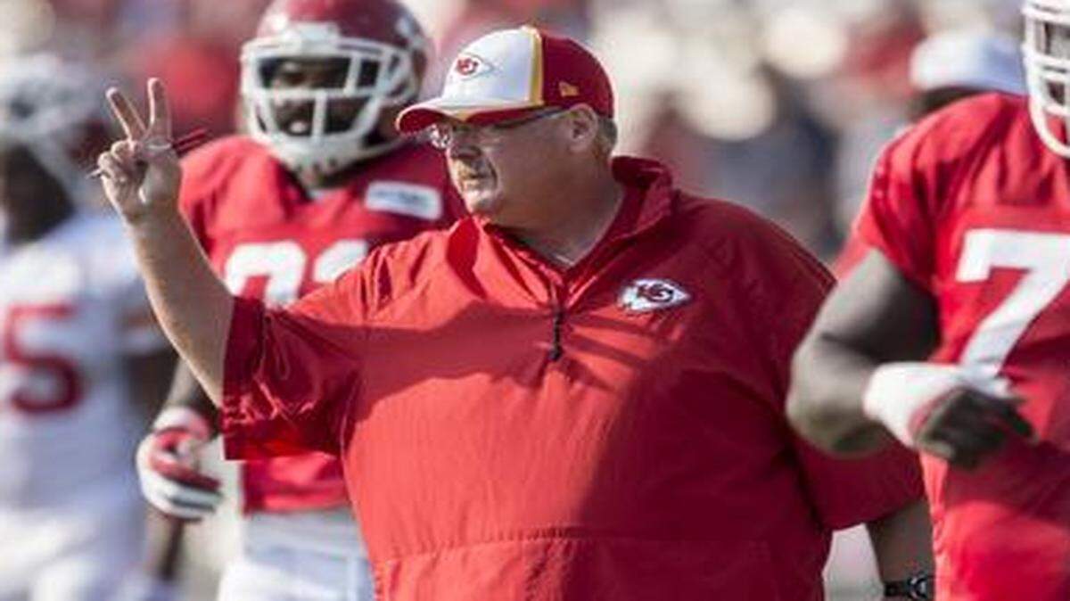 
Kansas City Chiefs head coach Andy Reid signaled in the offensive huddle during Kansas City Chiefs summer training camp practice at Missouri Western State University in St. Joseph, Mo.
