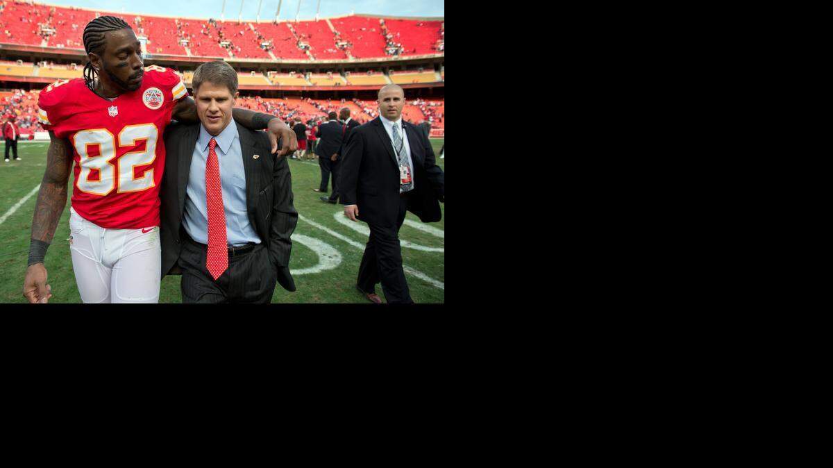
FILE PHOTO: Kansas City Chiefs wide receiver Dwayne Bowe (82) walked off the field arm in arm with Chiefs CEO Clark Hunt, center, following the team's 27-21 win over the Carolina Panthers on December 2, 2012 at Arrowhead Stadium in Kansas City, Mo. 

