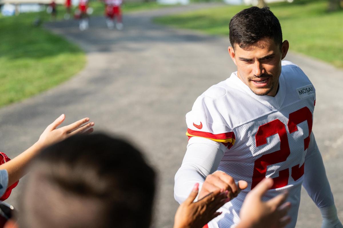 Chiefs linebacker Drue Tranquill gives fans some love during a training camp in July at St. Joseph.