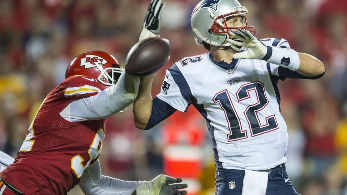 Kansas City Chiefs outside linebacker Tamba Hali stripped the football out of the hands of New England Patriots quarterback Tom Brady during a game on Sept. 29, 2014. The Chiefs won 41-14.