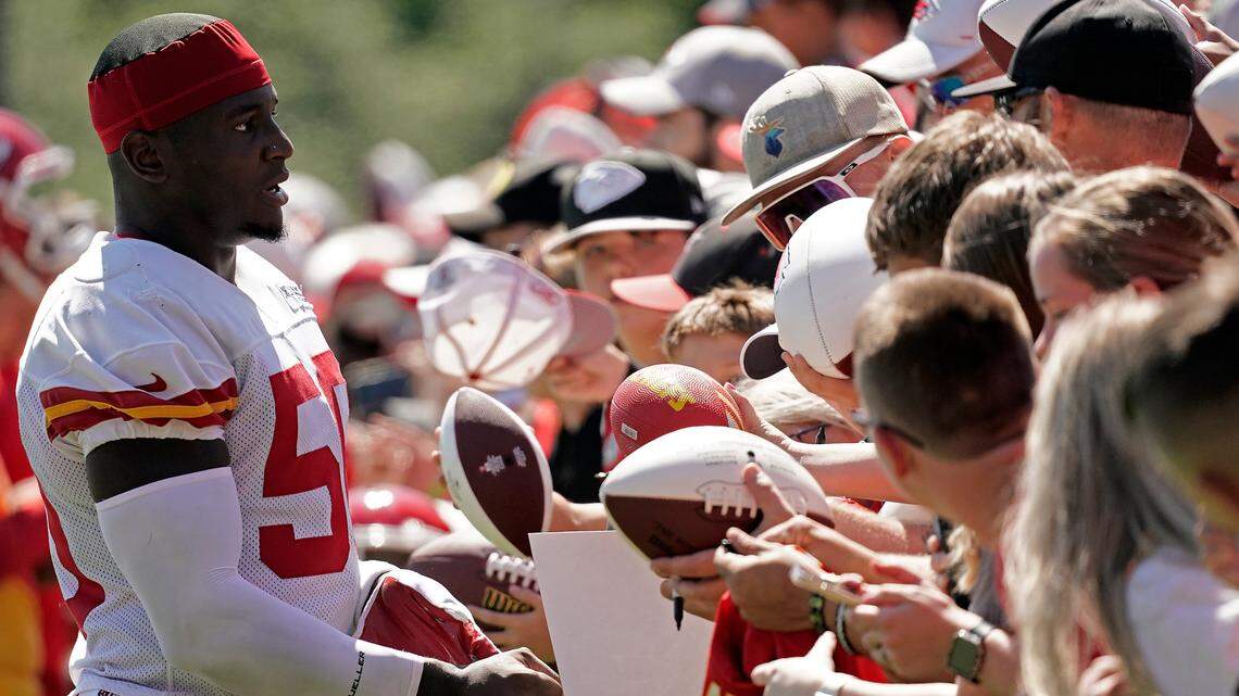 Kansas City Chiefs linebacker Willie Gay signs autographs at NFL football training camp Saturday, July 30, 2022, in St. Joseph, Mo.