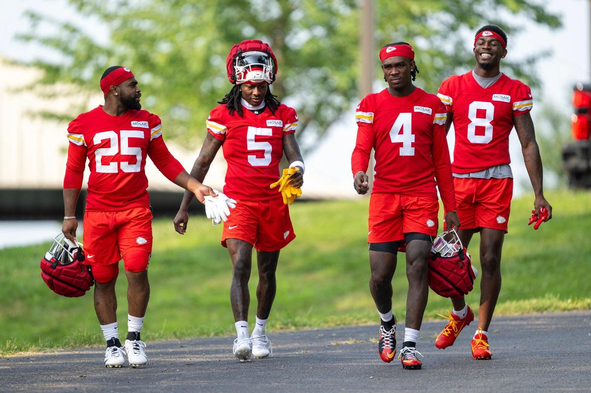 Chiefs running back Clyde Edwards-Hellaire (25), wide receivers Hollywood Brown (5), Rashee Rice (4) and Justyn Ross (8) walk to the field during training camp at Missouri Western State University on Wednesday, July 24, 2024, in St. Joseph.