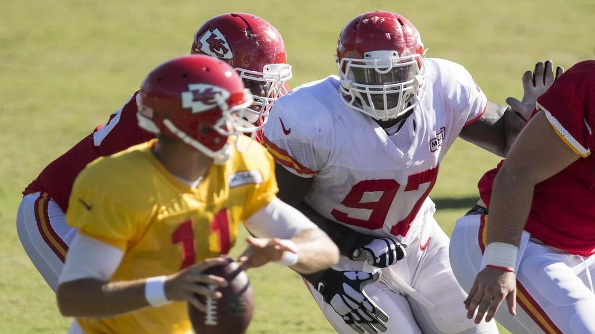 
Kansas City Chiefs defensive end Allen Bailey rushed towards quarterback Alex Smith during training camp practice Tuesday morning at Missouri Western State University in St. Joseph.
