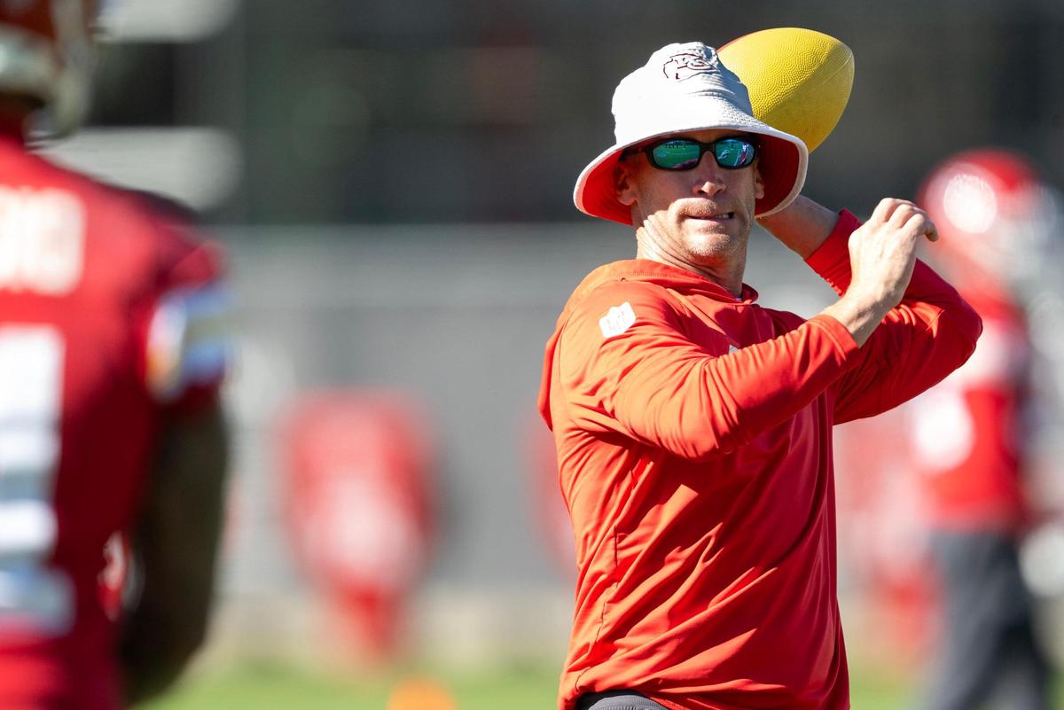 Joe Bleymaier, Chiefs pass game coordinator, prepares to throw a pass to a receiver during the team’s practice on Friday, Nov. 11, 2024, in Kansas City.