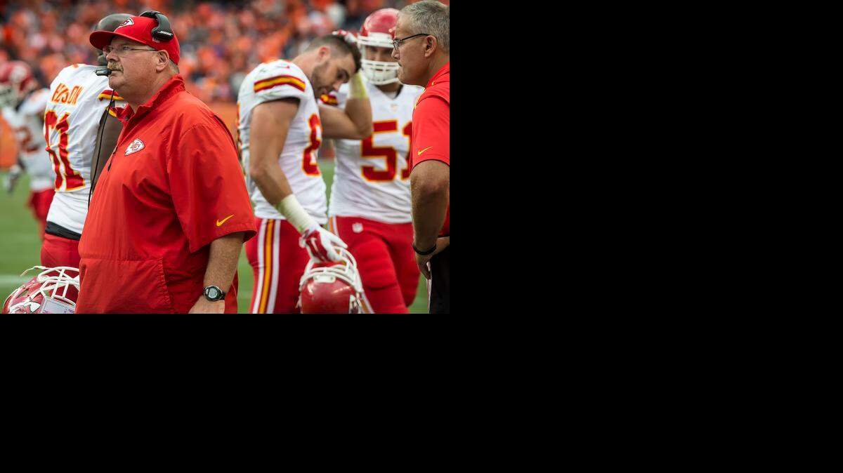 
Head coach Andy Reid watched the Chiefs’ unsuccessful fourth-and-2 play on the video board as tight end Travis Kelce (87) walked off the field in dejection after the Chiefs lost 24-17 to the Broncos in Denver. The Chiefs had the opportunity to score a touchdown on the last play to pull within an extra point of Denver, but the pass fell incomplete.
