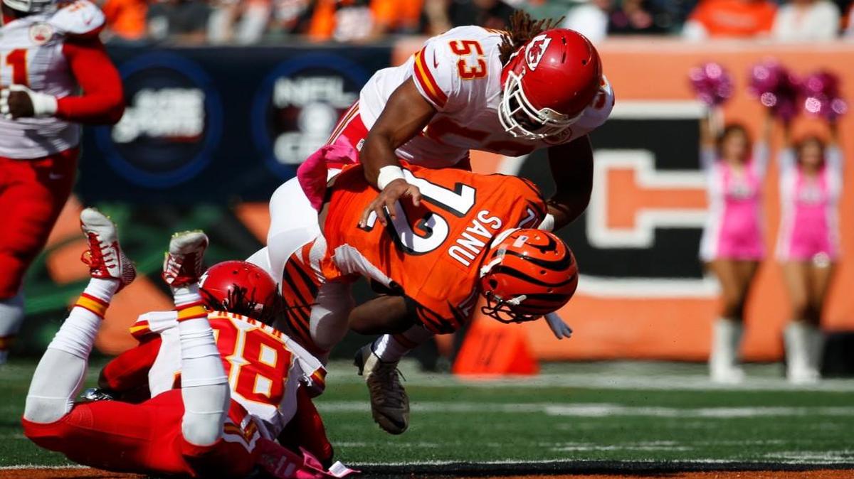 
Bengals wide receiver Mohamed Sanu (12) was tackled by Chiefs outside linebacker Ramik Wilson (53) during Sunday’s NFL football game in Cincinnati.
