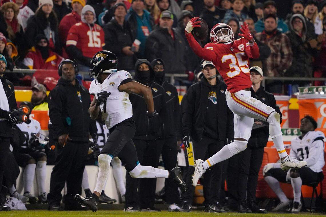 Kansas City Chiefs cornerback Jaylen Watson (35) intercepts a pass against the Jacksonville Jaguars during an NFL Divisional Playoff football game Saturday, Jan. 21, 2023, in Kansas City, Mo.