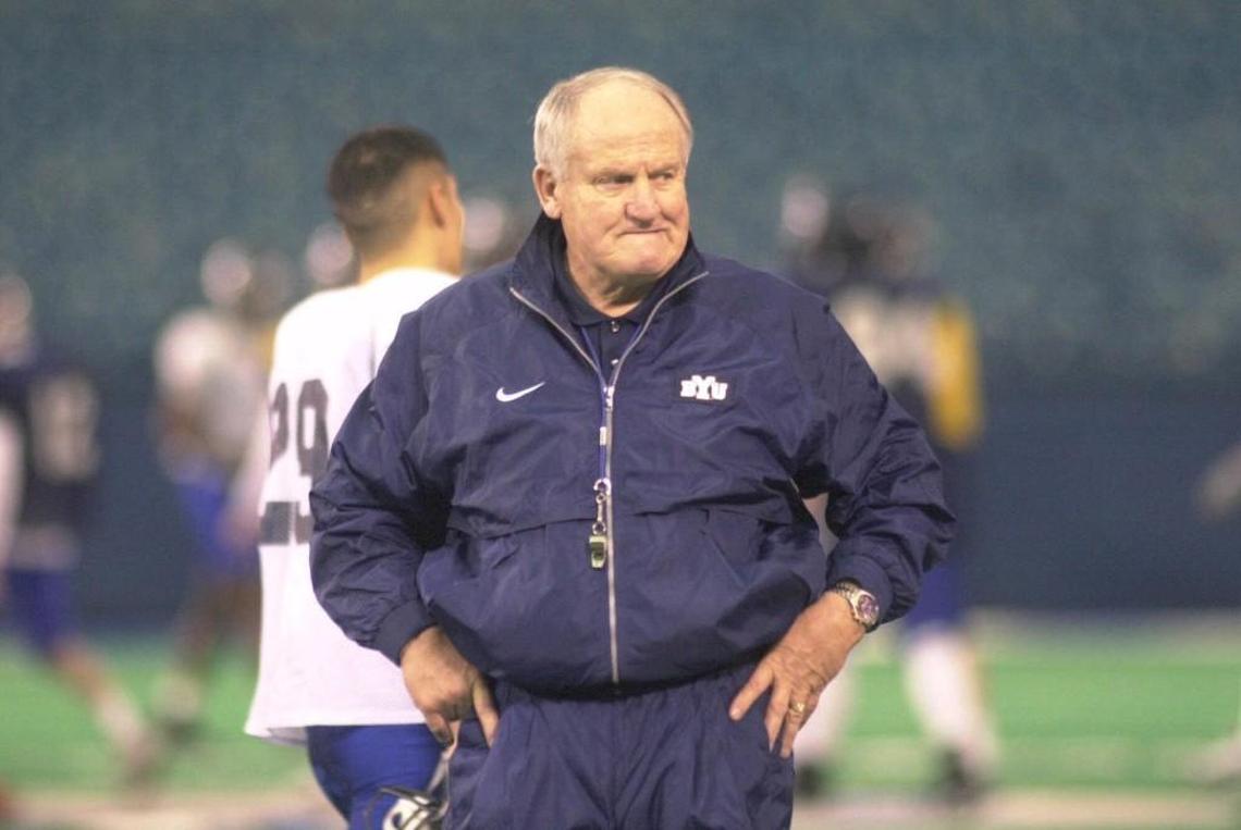 Brigham Young University head football coach LaVell Edwards watched his team practice in this Dec. 24, 1999 photo at the Silverdome in Pontiac, Mich. Edwards died Thursday.