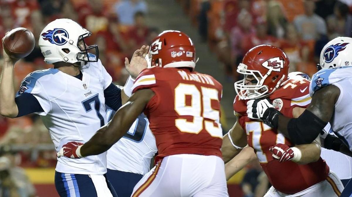 
Chiefs defensive end Mike Catapano and linebacker Josh Martin (95) pressured Titans quarterback Zach Mettenberger during their Aug. 28 football game at Arrowhead Stadium.
