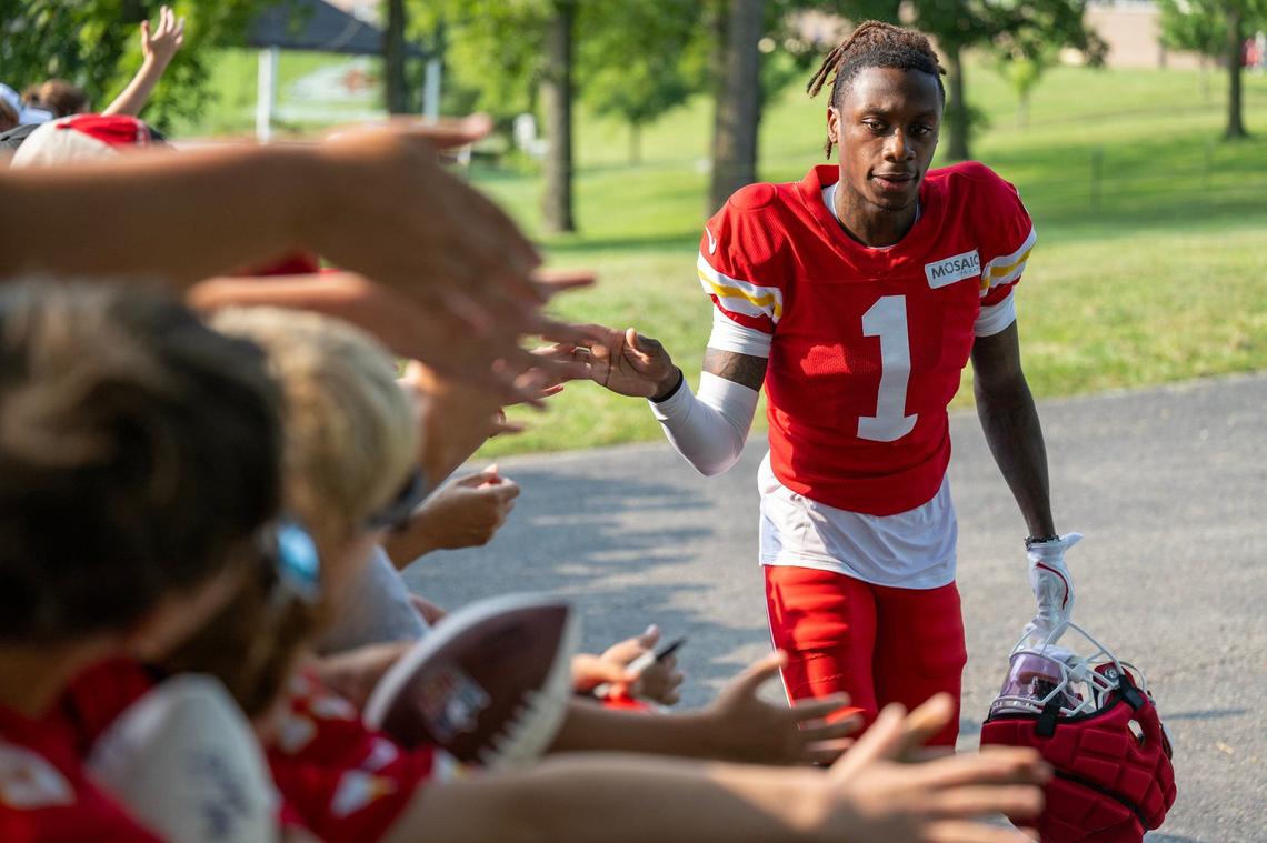 Chiefs rookie receiver Xavier Worthy (1) greets fans during training camp at Missouri Western State University on Saturday, July 27, 2024, in St. Joseph.