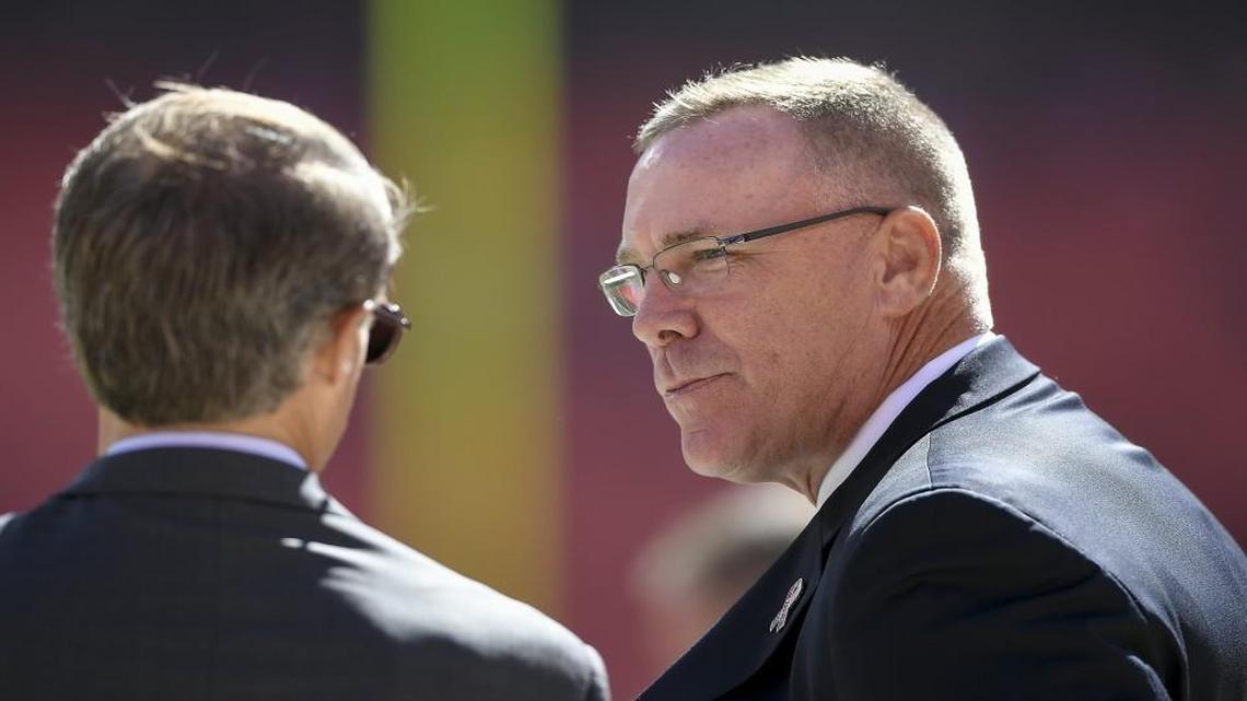 John Dorsey, right, had been the subject of speculation recently in Green Bay, where he cut his teeth as a front-office executive in the NFL. However, a source said on Saturday that the Chiefs general manager would stay in KC through at least the 2017 season.