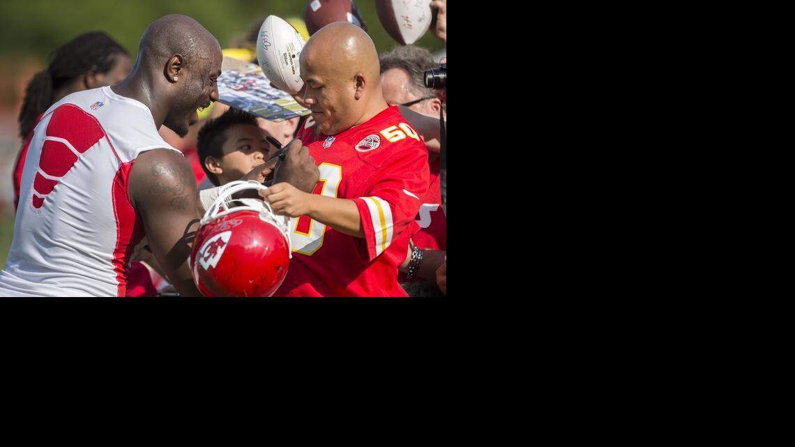 
Linebacker Justin Houston mingled easily with fans as he signed autographs Thursday at training camp in St. Joseph.
