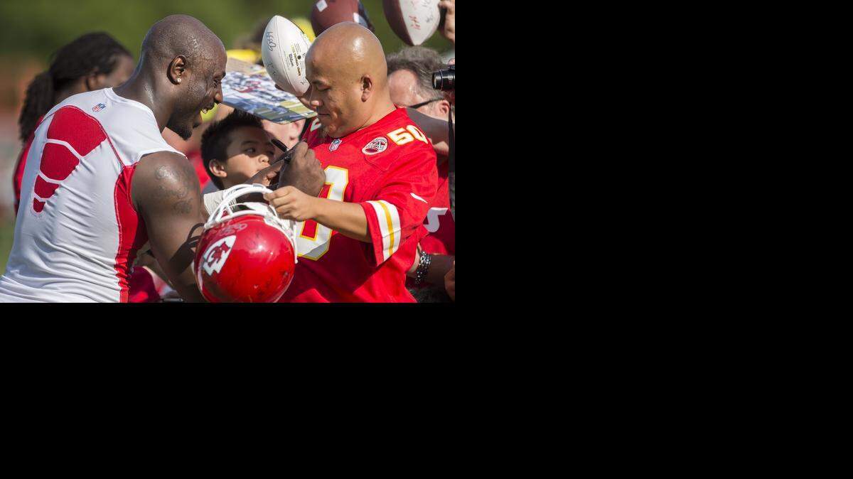 
Linebacker Justin Houston mingled easily with fans as he signed autographs Thursday at training camp in St. Joseph.
