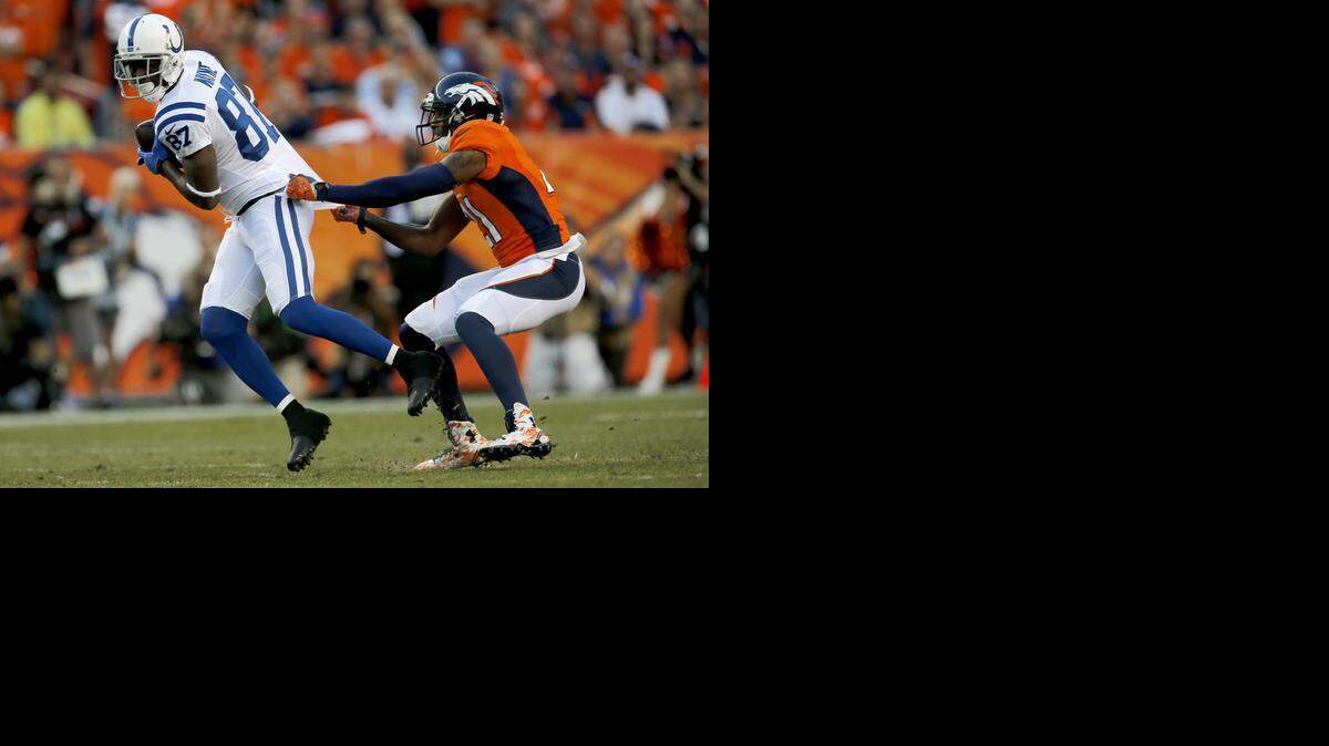 
Indianapolis Colts wide receiver Reggie Wayne was stopped by Denver Broncos cornerback Aqib Talib during last Sunday’s game.
