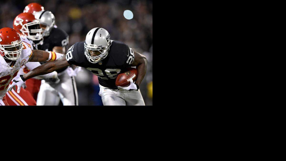 
Raiders rookie running back Latavius Murray (right) scored the first rushing touchdown against the Chiefs this season when he got into the end zone from 11 yards out in the first quarter on Thursday night.
