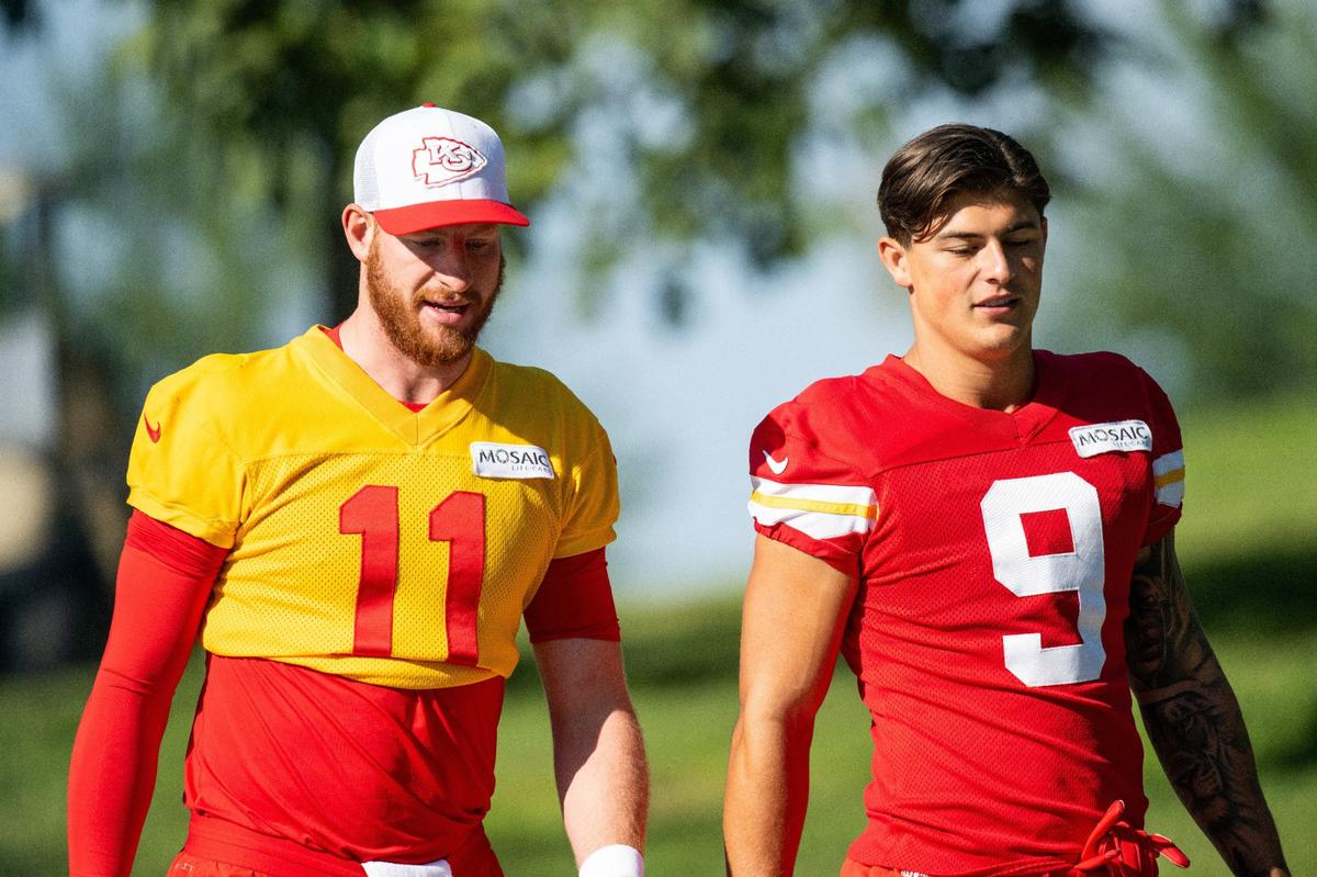 Kansas City Chiefs quarterback Carson Wentz (11) and Kansas City Chiefs running back Louis Rees-Zammit (9) walk to the field for Chiefs training camp on Thursday, July 18, 2024, in St. Joseph.