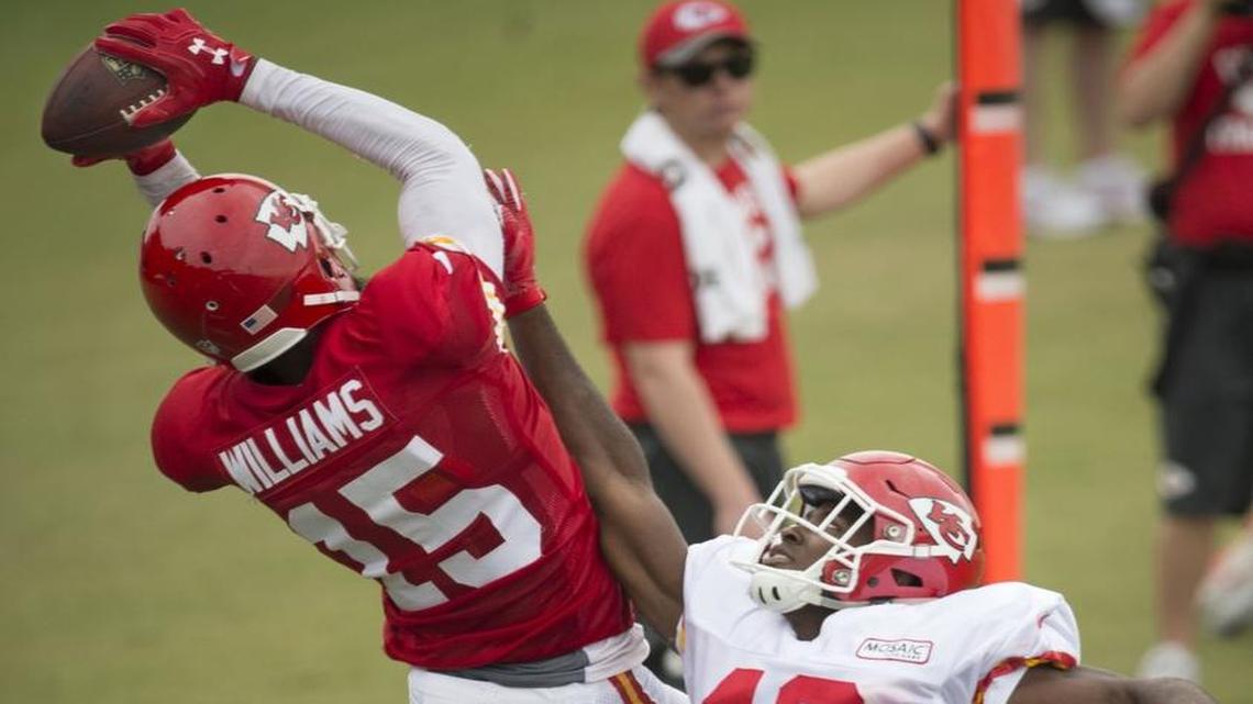 Wide receiver Mike Williams (15) had the ball knocked out of his hands by defensive back Vernon Harris (48) during Chiefs training camp Tuesday at Missouri Western State University. The Chiefs released Harris on Saturday.