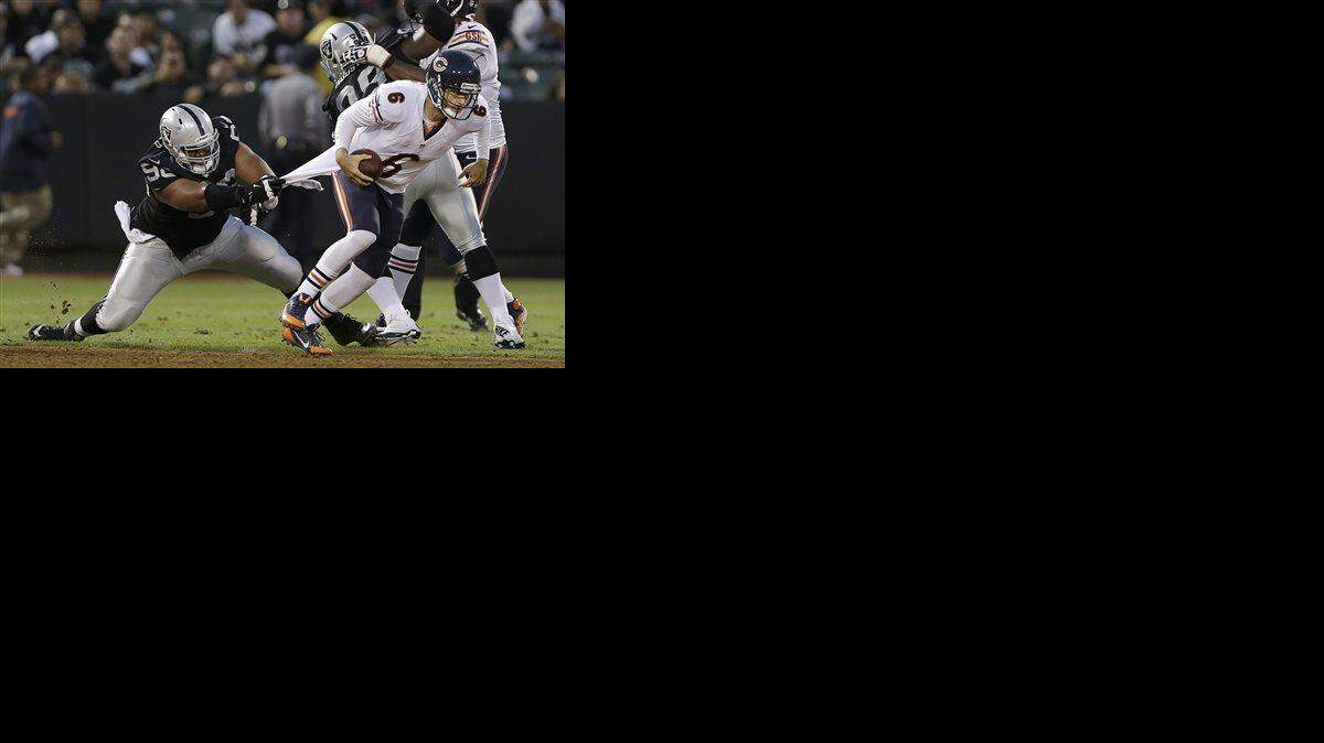 
The Chiefs would like for Vance Walker (left), here tormenting Bears quarterback Jay Cutler in a preseason game last year, to create mayhem in the backfield of opposing offenses.
