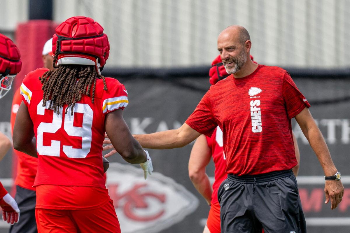 Kansas City Chiefs offensive coordinator Matt Nagy greets running back Kareem Hunt (29) during practice at the Chiefs training complex on Wednesday, Sept. 18, 2024, in Kansas City.