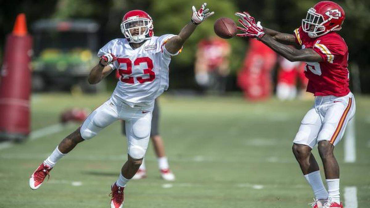 
Kansas City Chiefs cornerback Phillip Gaines (left) defended a pass attempt to wide receiver A.J. Jenkins on Monday morning during training camp in St. Joseph, Mo. Jenkins has been dealing with a hamstring injury.
