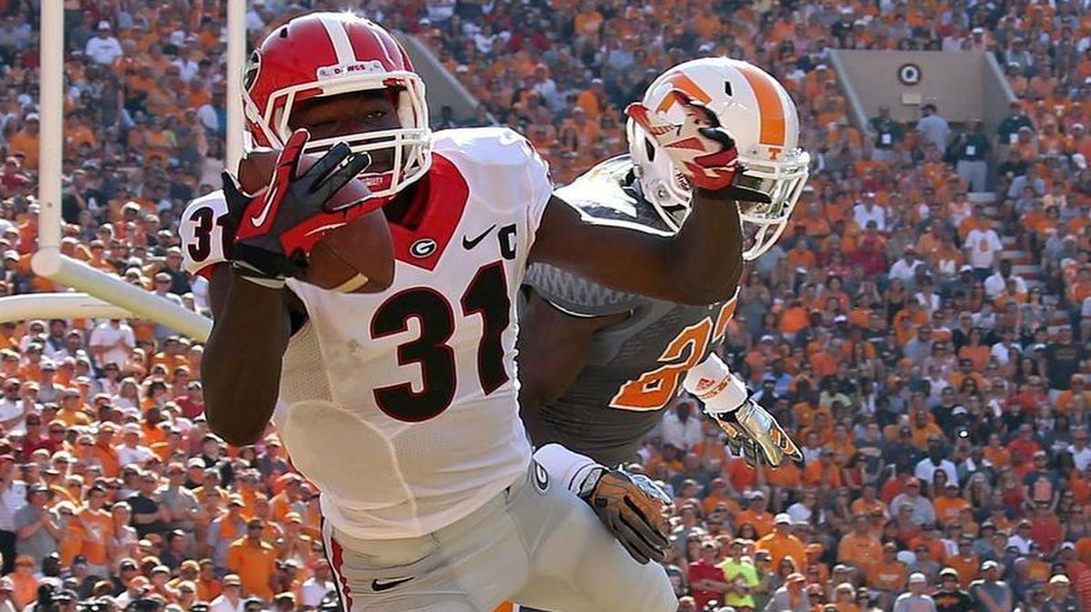
Georgia wide receiver Chris Conley made a one-handed 1-yard touchdown pass in front of Tennessee defensive back Justin Coleman in 2013. 

