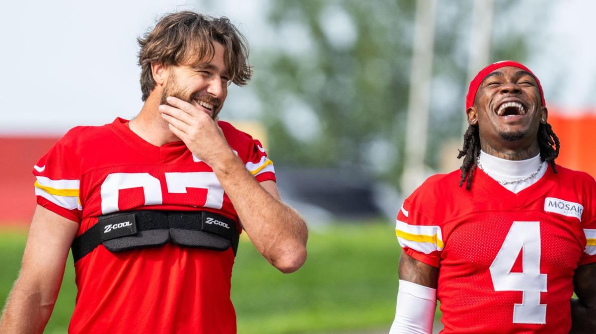 Kansas City Chiefs wide receiver Rashee Rice (4) laughs with Kansas City Chiefs tight end Travis Kelce (87) while walking towards the practice field on the first day of Chiefs training camp on Tuesday, July 22, 2025 in St. Joseph.