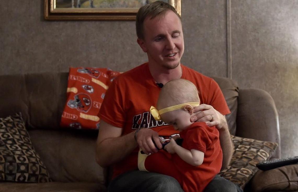 Cameron Black, with daughter Addelyn on his knee, has become a devoted Chiefs fan with help from his father, who now lives in Alaska but communicates with his son often. Cameron will often email his dad, Todd Black, to get help understanding a formation or play.