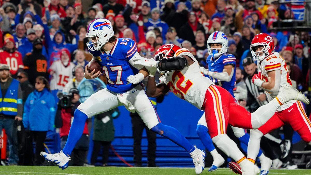 Buffalo Bills quarterback Josh Allen (17) runs with the ball for a touchdown against Kansas City Chiefs linebacker Nick Bolton (32) during the second half on Nov. 17, 2024, at Highmark Stadium in Orchard Park, New York.