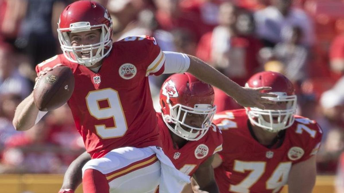 Kansas City Chiefs quarterback Tyler Bray high-stepped his way out of a tackle by Seattle Seahawks defensive tackle Quinton Jefferson during a preseason game against Seattle at Arrowhead Stadium on Aug. 13, 2016.