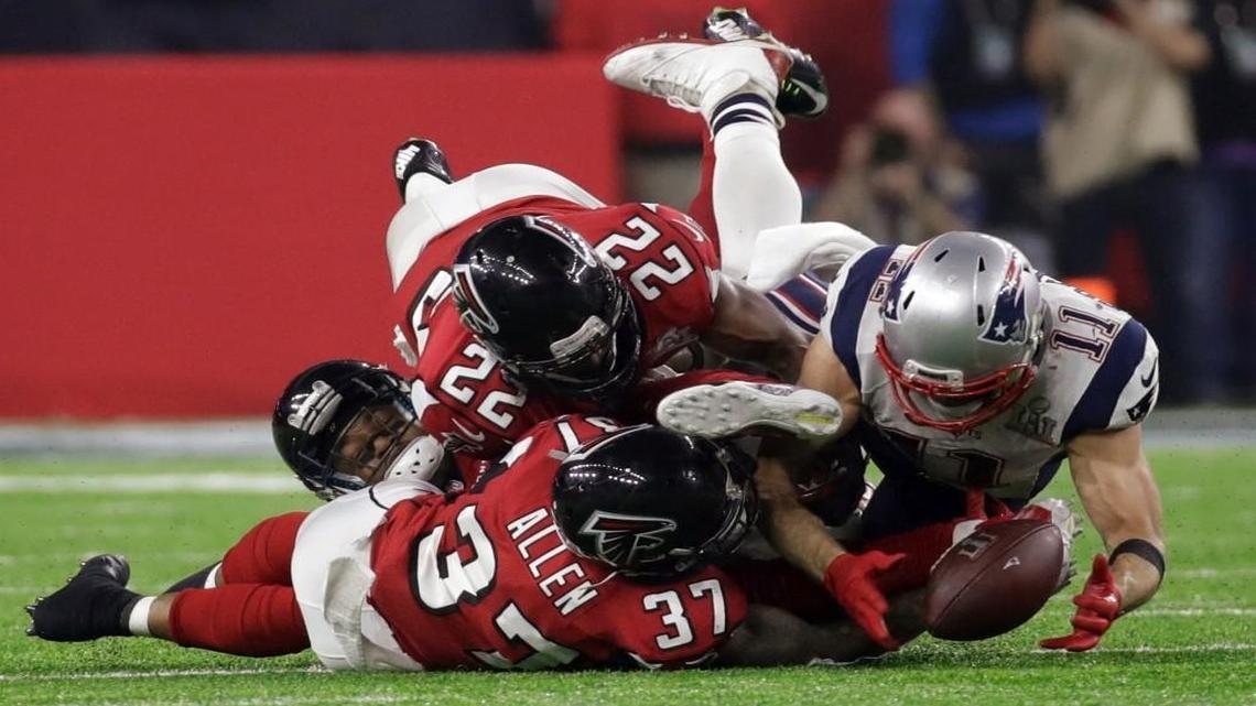 The Patriots’ Julian Edelman made the catch before the ball hit the ground as the Falcons’ Ricardo Allen and Keanu Neal defended in the second half of Super Bowl LI on Sunday in Houston. The Patriots rallied to win 34-28 in overtime for the team’s fifth NFL championship.