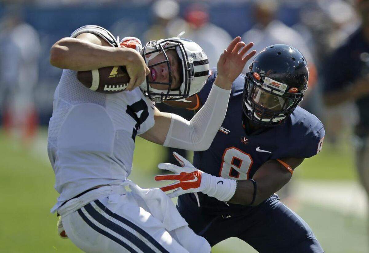 Virginia safety Anthony Harris tackled Brigham Young quarterback Taysom Hill on Sept. 20 in Provo, Utah. 