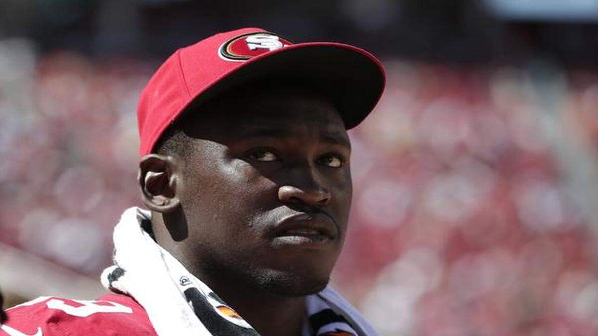 
In this Aug. 17, 2014 file photo, San Francisco 49ers linebacker Aldon Smith watched the second half of a preseason football game against the Denver Broncos in Santa Clara, Calif. Smith has been suspended for nine games by the NFL after a series of off-field legal issues. 
