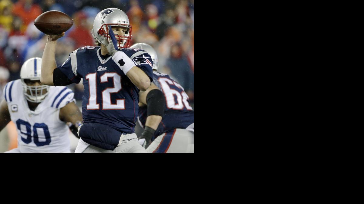 
New England Patriots quarterback Tom Brady looks to pass during the first half of the NFL football AFC Championship game against the Indianapolis Colts 
