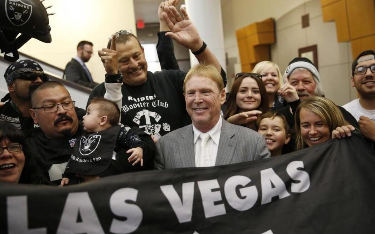 In this April 28, 2016, file photo, Oakland Raiders owner Mark Davis (center) met with Raiders fans after speaking at a meeting of the Southern Nevada Tourism Infrastructure Committee, in Las Vegas.