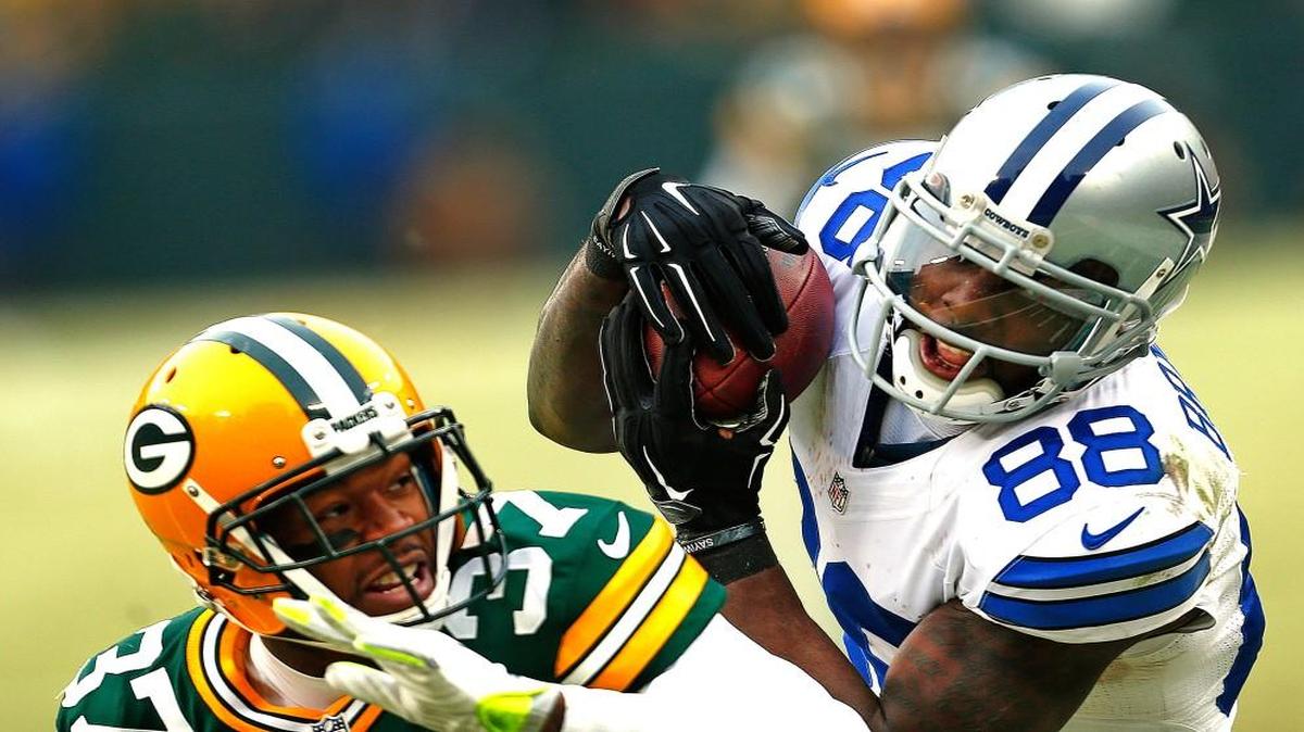 Dallas Cowboys wide receiver Dez Bryant (88) makes a would be catch over Green Bay Packers cornerback Sam Shields (37) late in the fourth quarter on Sunday, Jan. 11, 2015, at Lambeau Field in Green Bay, Wis. The play was ruled a catch but was overturned via instant replay.