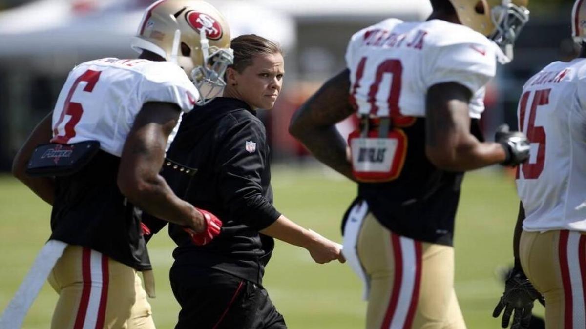 Katie Sowers, a Hesston High School graduate, was hired as a full-time assistant by the San Francisco 49ers of the National Football League earlier this summer. This week, Sowers, seen here at 49ers training camp in Santa Clara, Calif., on Aug. 8, came out as gay.