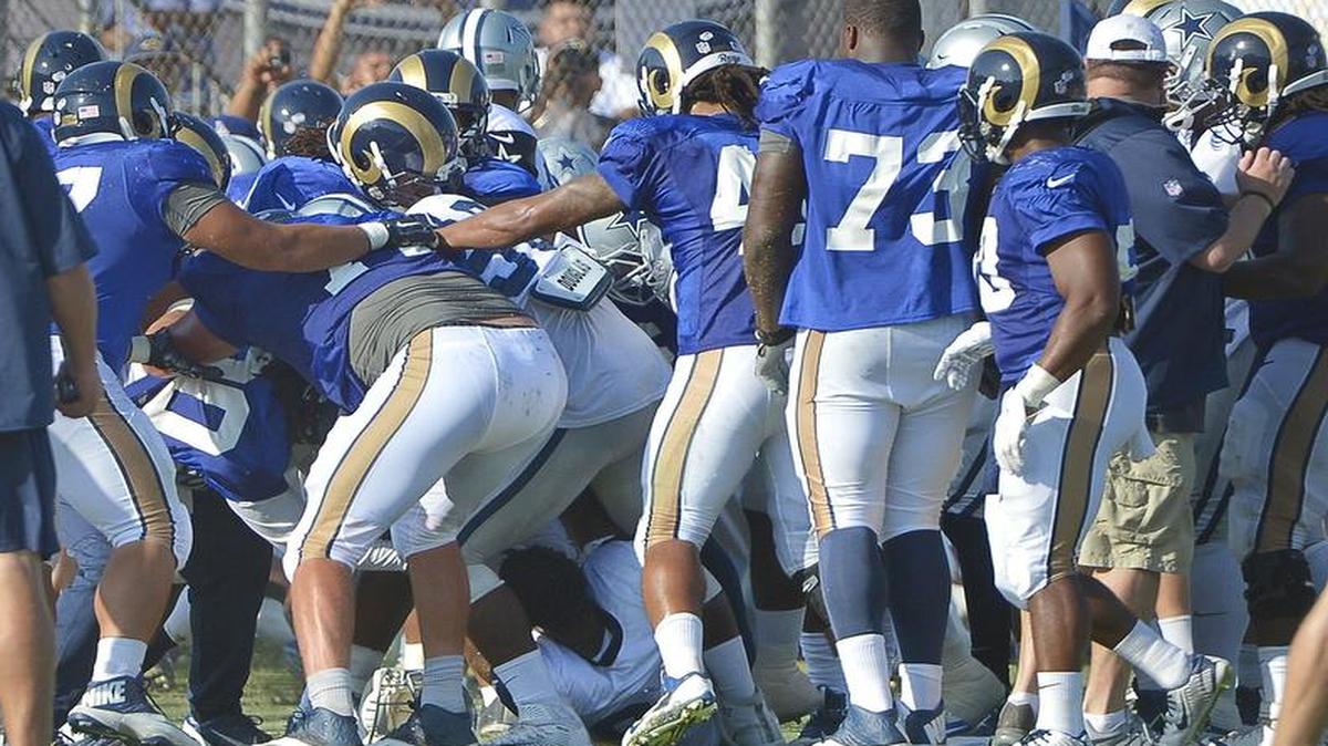 
Players clear the benches during two on-field fights during the joint Cowboys and Rams practice at Cowboys Training Camp in Oxnard, Calif., on Tuesday.
