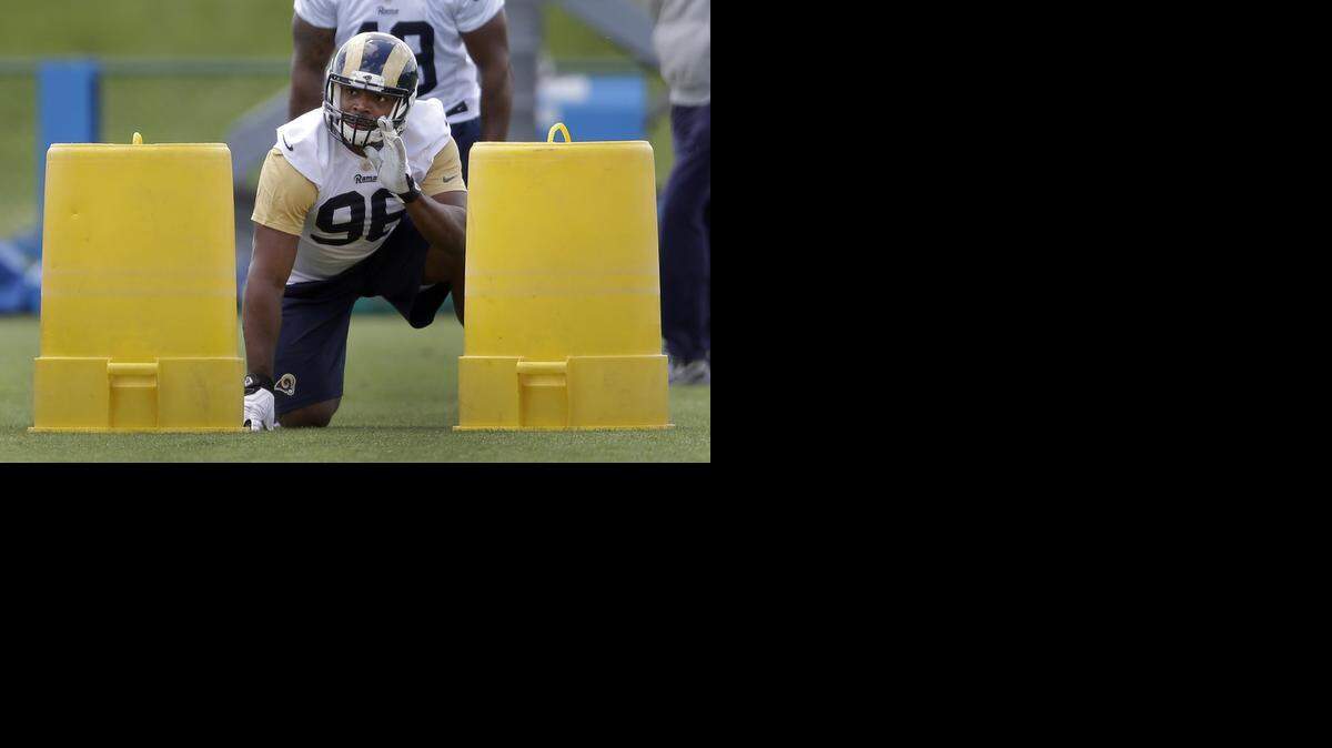 
St. Louis Rams seventh-round draft pick Michael Sam took part in a drill during the team’s NFL football rookie camp in St. Louis. Whether or not Sam makes the Rams final roster, becoming the first openly gay player in the NFL, will remain a hot topic throughout the preseason.
