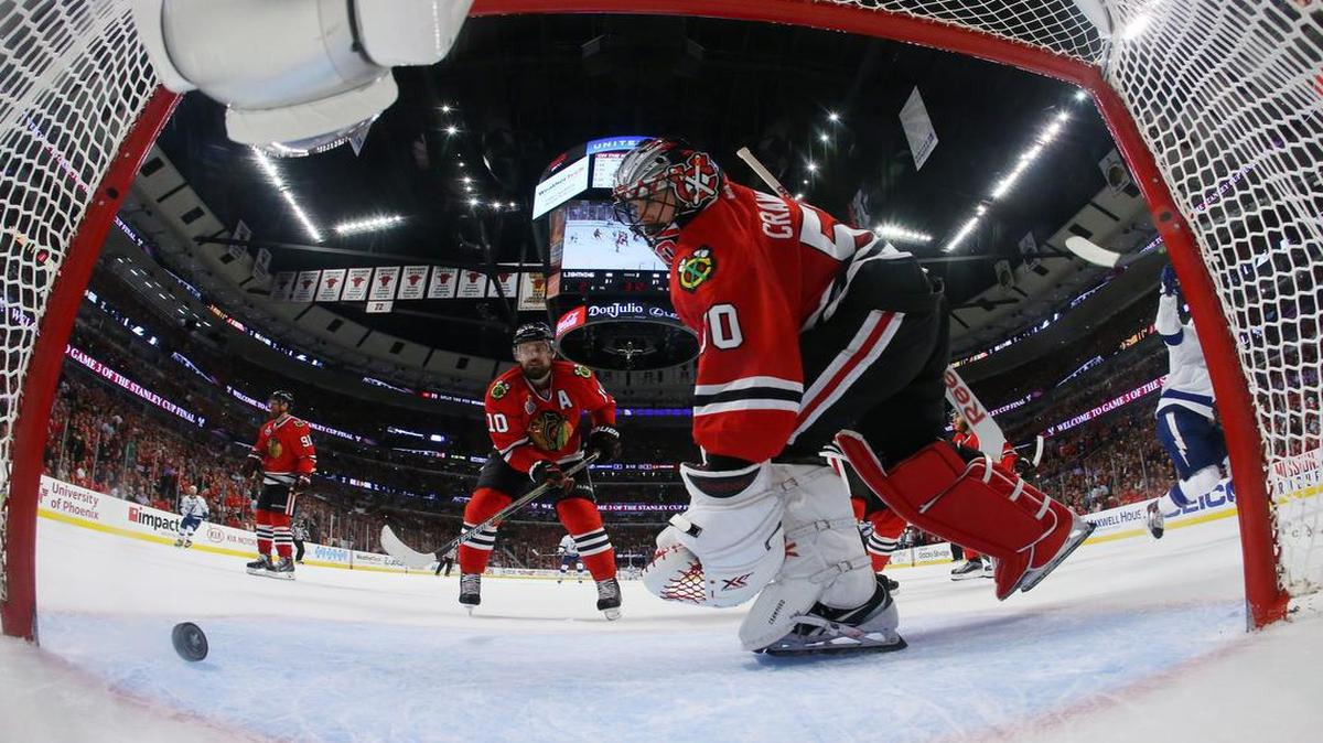 
Chicago Blackhawks goalie Corey Crawford (50) and left wing Patrick Sharp (10) looked at the puck after Tampa Bay Lightning center Cedric Paquette (13) scored a goal in the third period in game three of the NHL Stanley Cup Final on Monday in Chicago. The Lightning won 3-2 and took a 2-1 lead in the series. 
