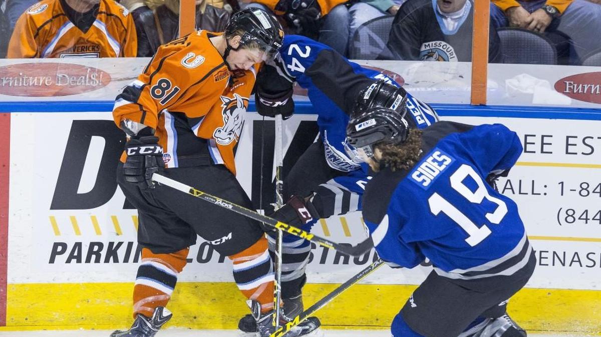 Sebastien Sylvestre (left) of the Missouri Mavericks and Theo Peckham (center) and Joey Sides of the Wichita Thunder competed for the puck at an October game at Silverstein Eye Centers Arena in Independence.