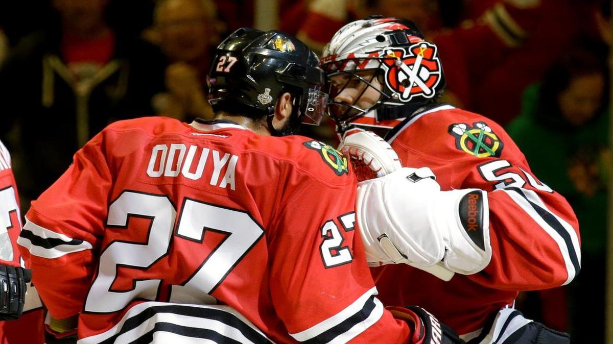 
Chicago Blackhawks goalie Corey Crawford (right) and teammate Johnny Oduya, of Sweden, celebrated following the Blackhawks' 2-1 victory over the Tampa Bay Lightning in Game 4 of the Stanley Cup Final on Wednesday in Chicago. The series is tied 2-2.
