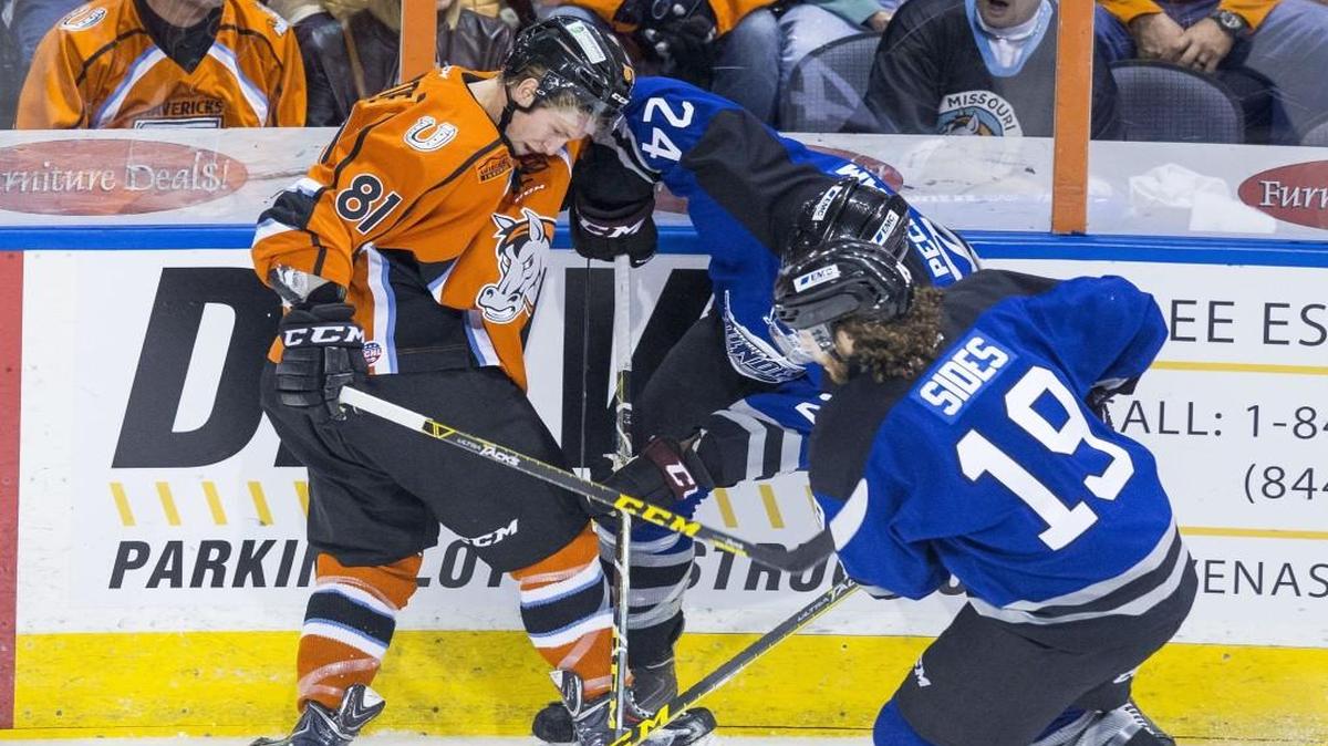 Sebastien Sylvestre (left) of the Missouri Mavericks competed for the puck with Theo Peckham (center) and Joey Sides of the Wichita Thunder during a game at the Silverstein Eye Centers Arena in October 24.