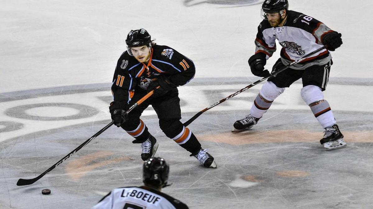 
Missouri Mavericks forward Jared Brown meandered between two Brampton Beast players in the Mavericks’ final home game of the season on April 7, 2015, at the Independence Events Center.
