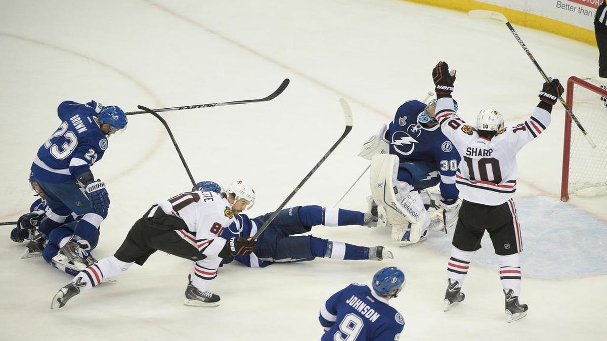 
Chicago Blackhawks center Antoine Vermette (80), celebrated his game winning goal with Patrick Sharp (10) during the third period in Game 1 of the NHL Stanley Cup Final against the Tampa Bay Lightning on Wednesday in Tampa, Fla.
